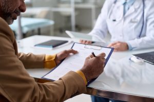 employee receiving medical leave note from a doctor
